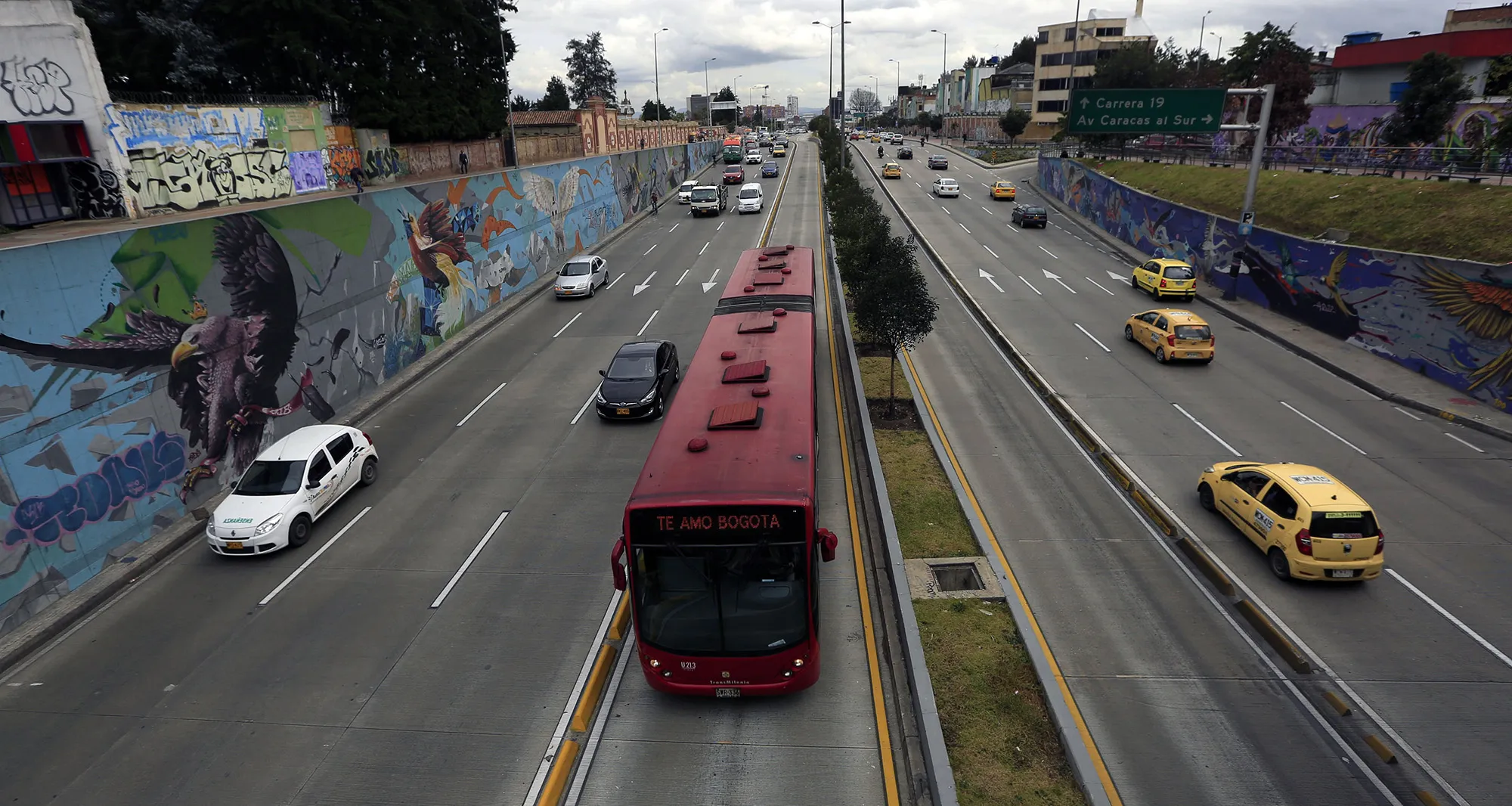 General view of traffic driving through 26 street in Bogota.