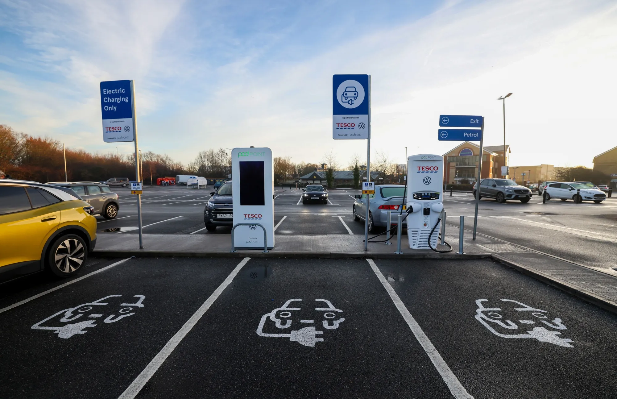 Electric vehicle charging stations outside a Tesco Plc supermarket in Maldon, U.K., earlier in January. 