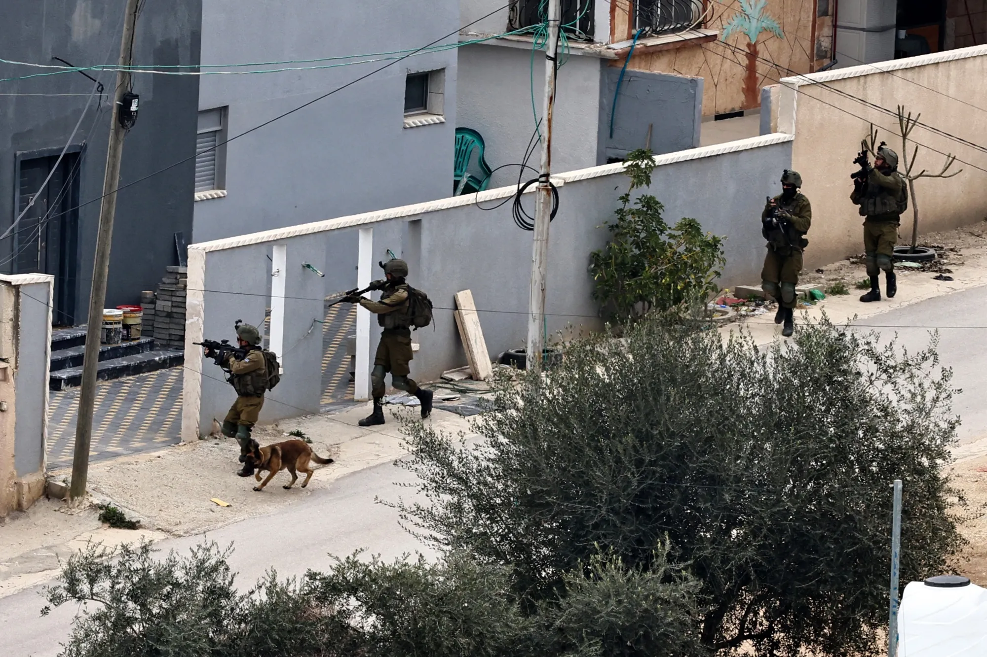 Israeli soldiers deploy during ongoing raids in the occupied West Bank.