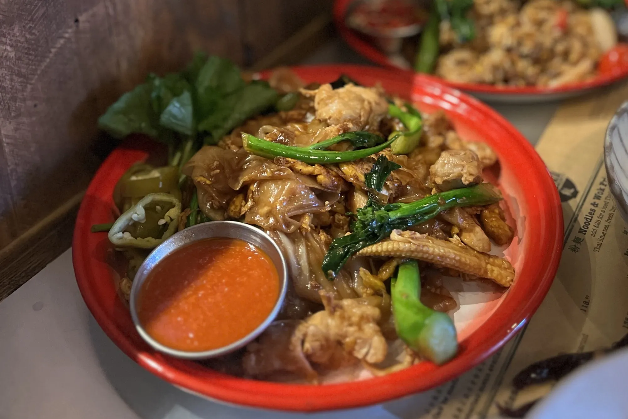 The stir-fried chicken and flat noodles.
