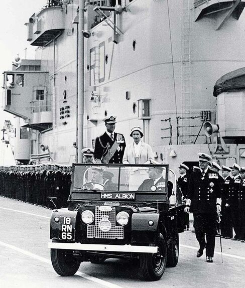 Queen Elizabeth II and The Duke of Edinburgh take a ride in a Series II during a royal tour in 1957.