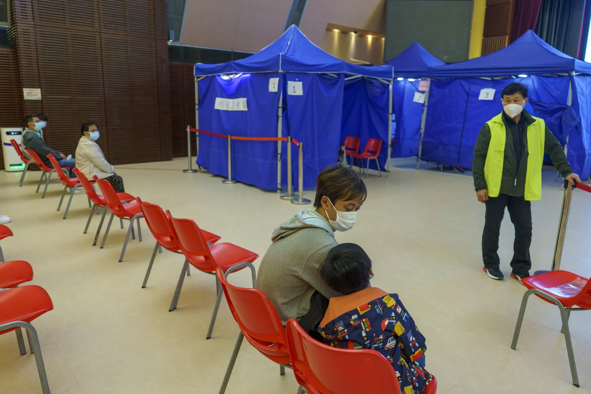 A child waits at a community vaccination center in Hong Kong.