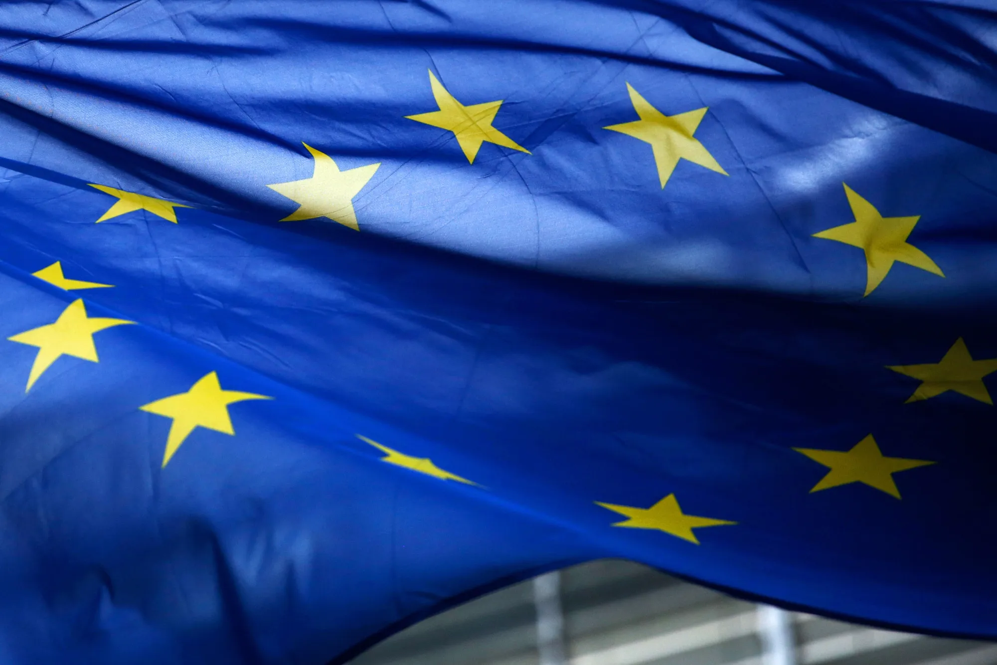 The stars of the European Union (EU) sit on a flag flying outside the Berlaymont building ahead of a news conference at the end of the fifth round of Brexit negotiations in Brussels, Belgium, on Thursday, Oct. 12, 2017. The European Union said scant progress has been made in the latest round of Brexit talks, increasing the chances of a messy departure as time is running out to clinch a deal.