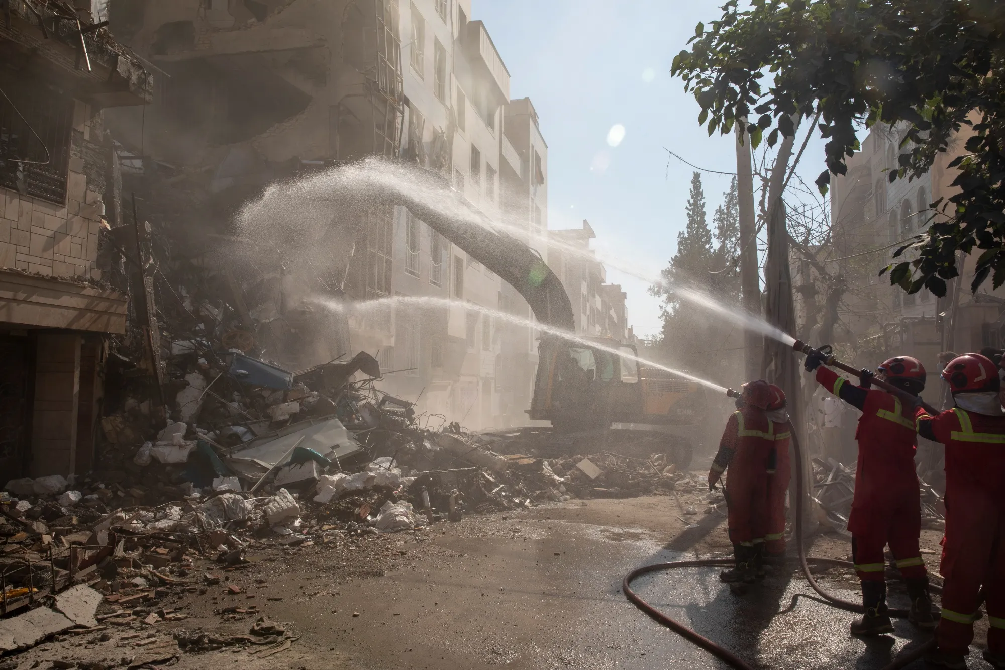 Firefighters extinguish a fire in a building that was destroyed in an Israeli attack in Tehran, Israel, on June 13, 2025.