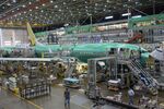 Workers assemble an airplane at Boeing's factory in Renton, Washington, U.S..