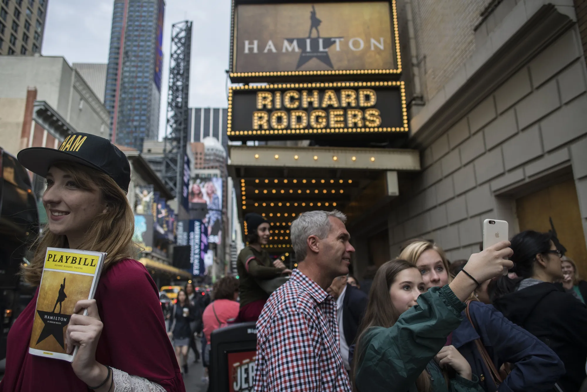 
Attendees take photographs outside of the 'Hamilton' musical in&nbsp;New York on May 22, 2016.
