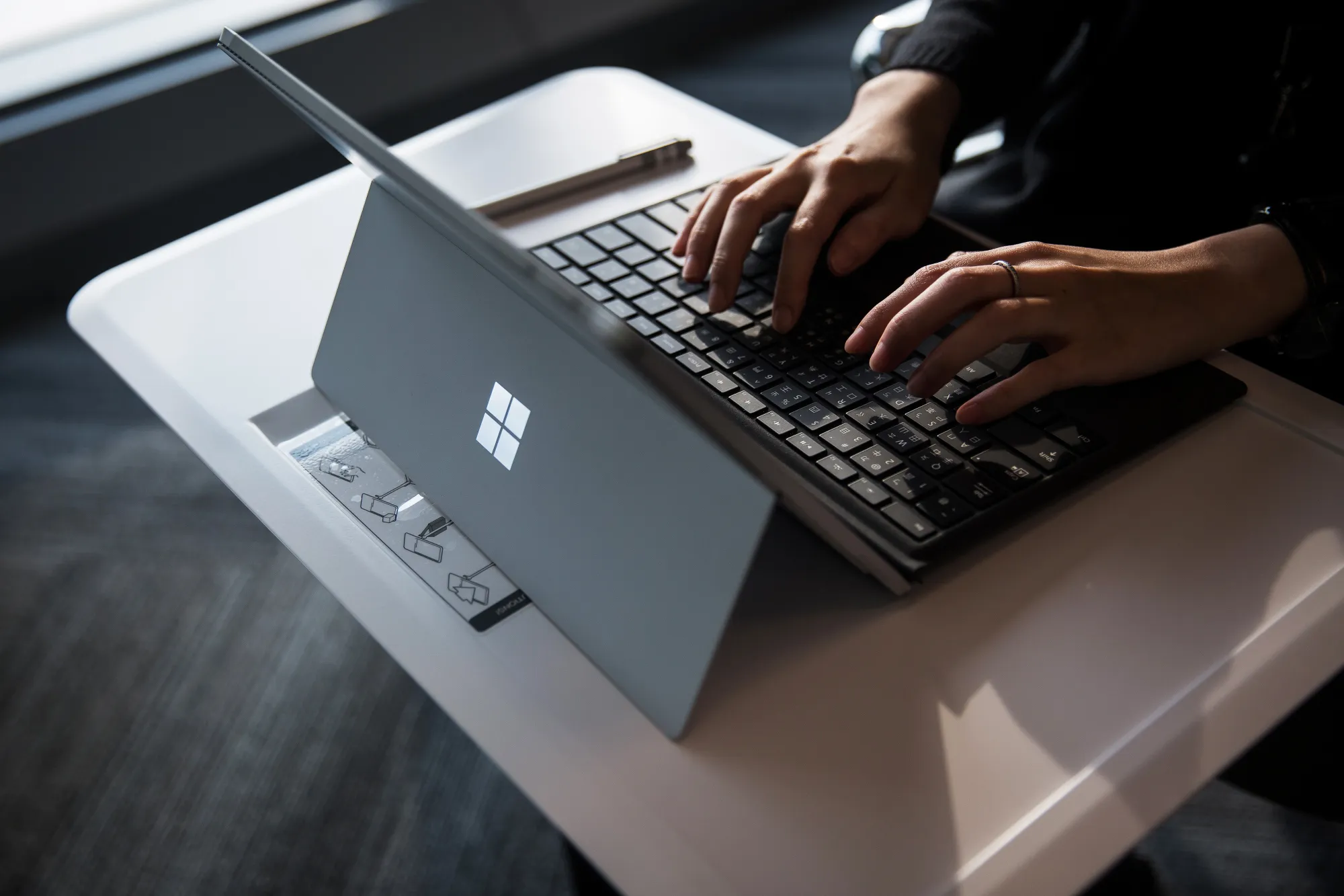 An employee uses a Microsoft Surface tablet computer.