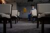 Doctor Brad Baker is seated in the last row of chairs in Saint Claire’s chapel.