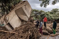 A destroyed vehicle carried by floodwaters in  Kamuchiri, Kenya, on April 29.