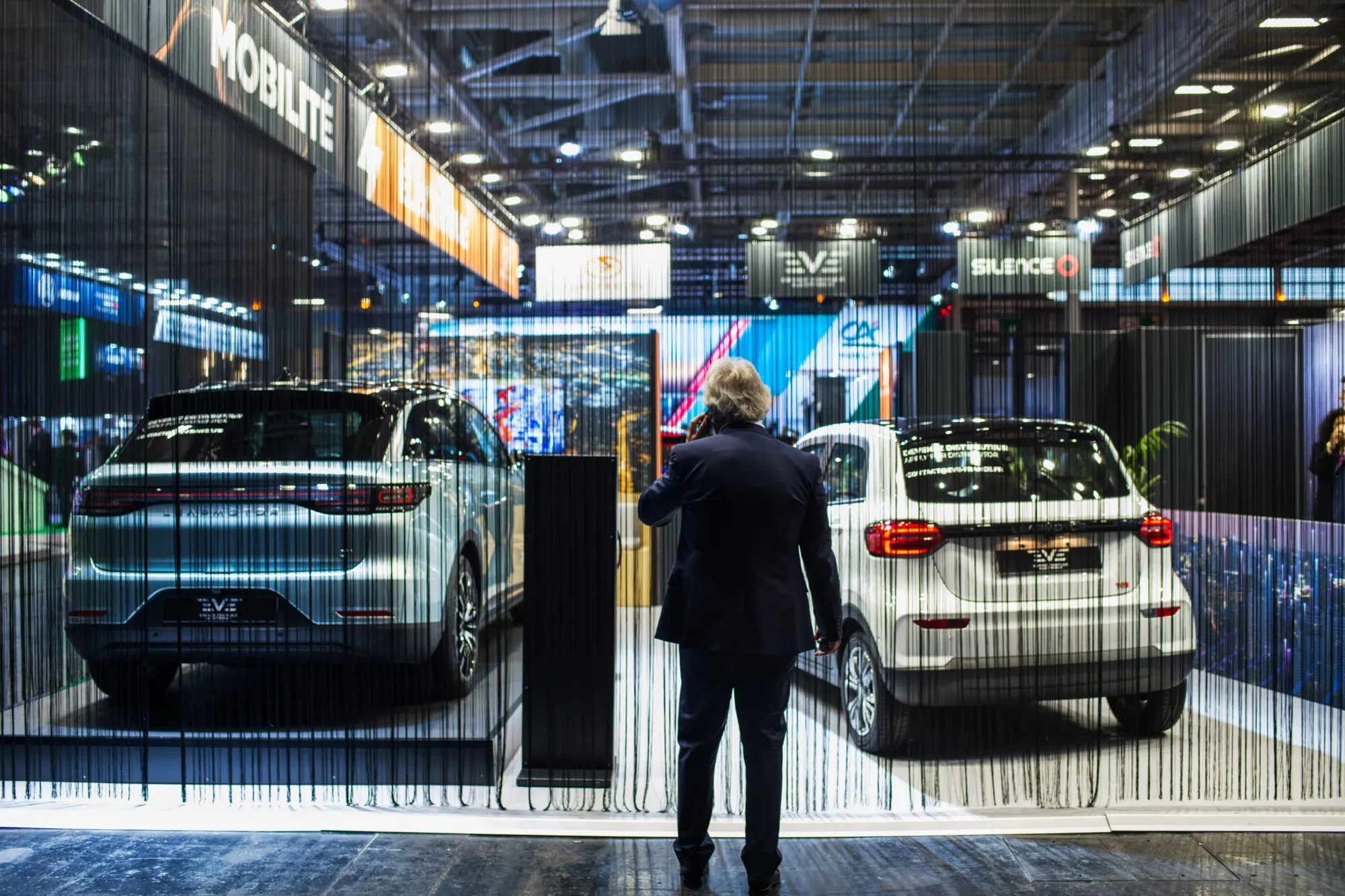 A Leapmotor C11 electric SUV, left, and a Leapmotor TO3 electric mini car at the Paris Motor Show in 2022.