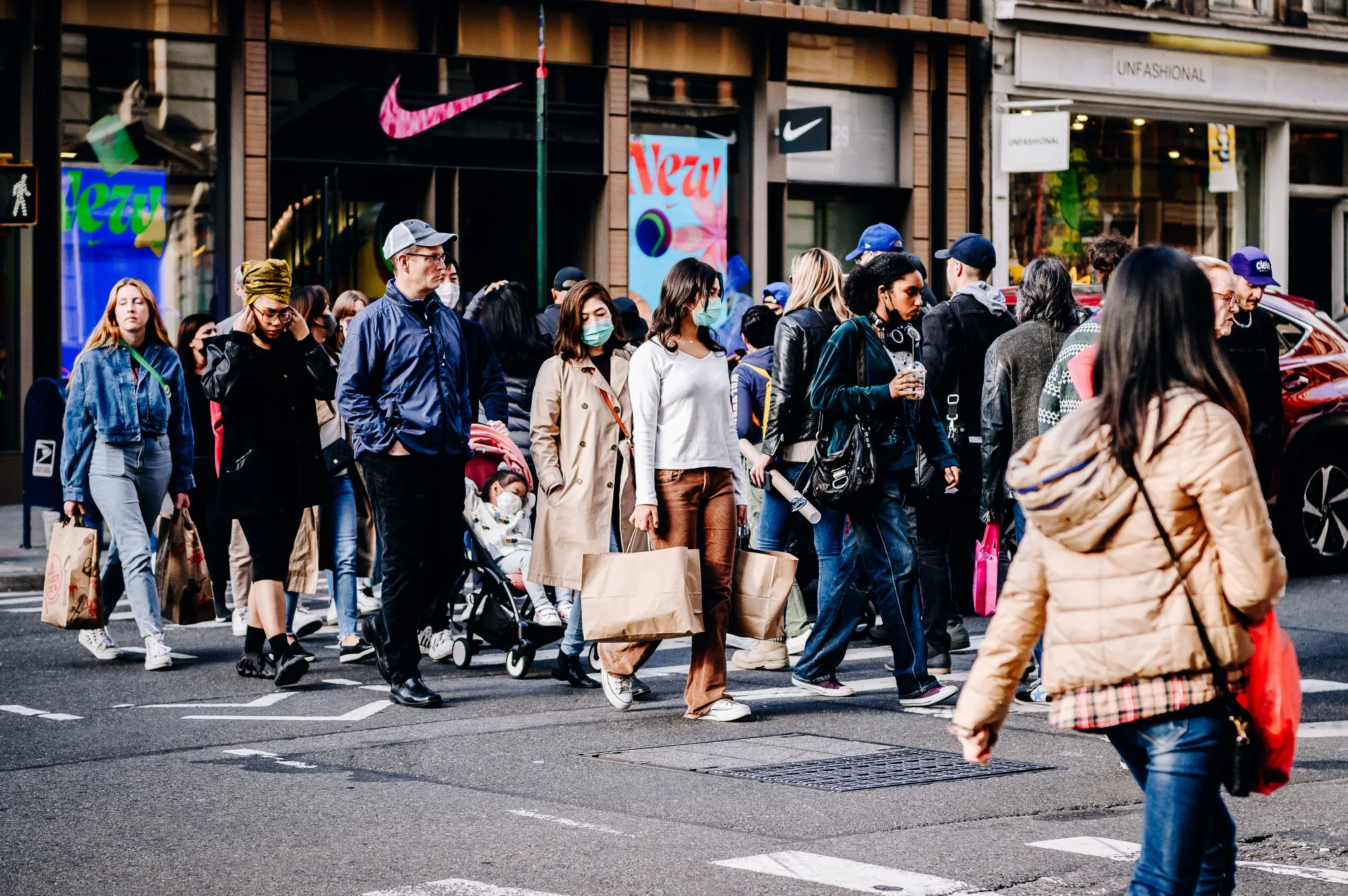 Pedestrians carry shopping bags in the SoHo neighborhood of New York.