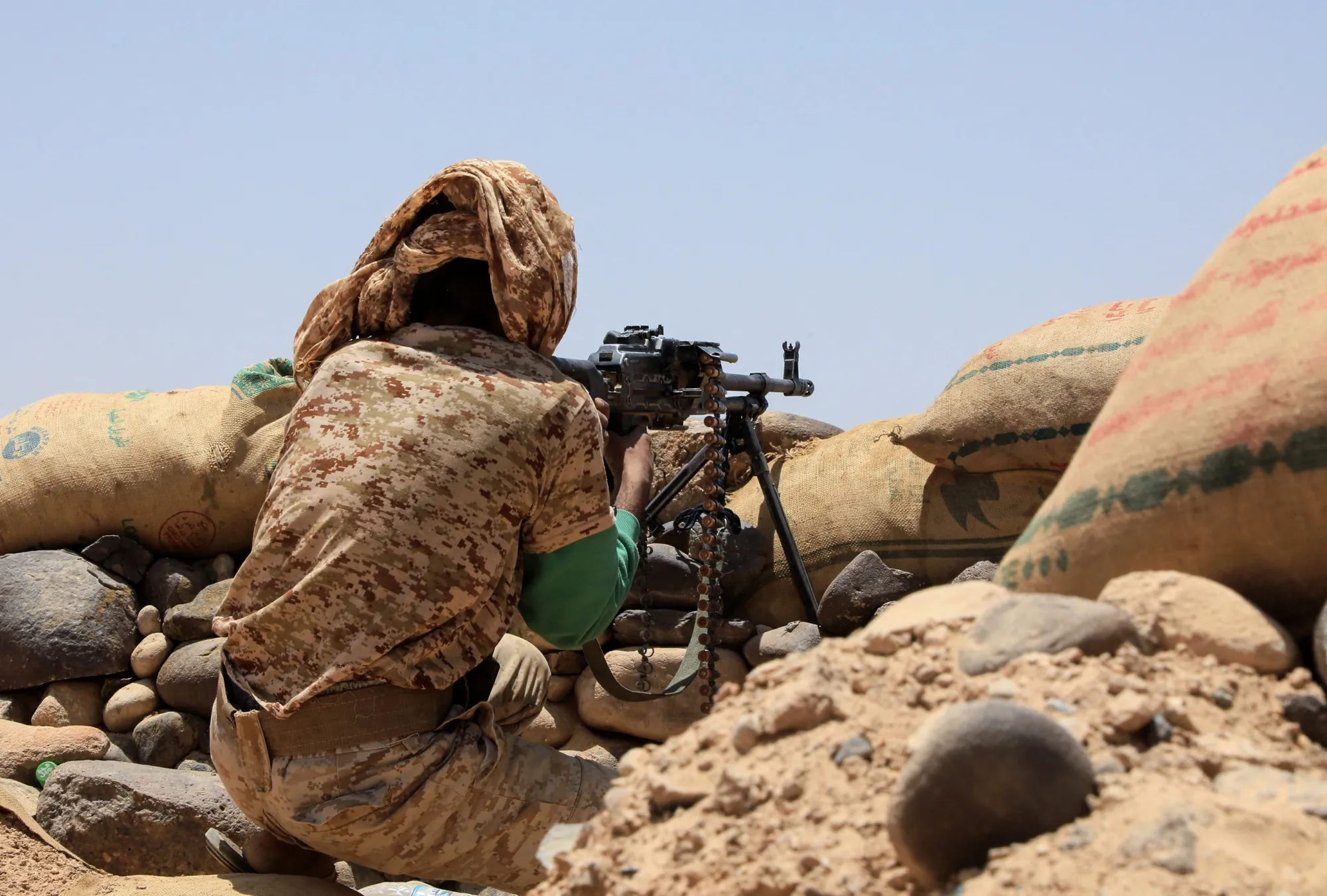 A fighter with forces loyal to Yemen's Saudi-backed government holds a position against Huthi rebels in Yemen's northeastern province of Marib&nbsp;on April 6.