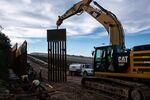 A construction crew works on replacing the US-Mexico border fence as seen from Tijuana, in Baja California state, Mexico, on January 9, 2019.