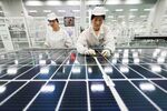 Employees work on photovoltaic cell modules, used in solar panels, at a factory which produces the modules for export to the US and Europe, in Lianyungang, in China's eastern Jiangsu province on September 26, 2025. (Photo by AFP) / China OUT (Photo by -/AFP via Getty Images)