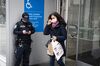 A commuter wearing a protective mask exits from a subway station in New York, U.S.,