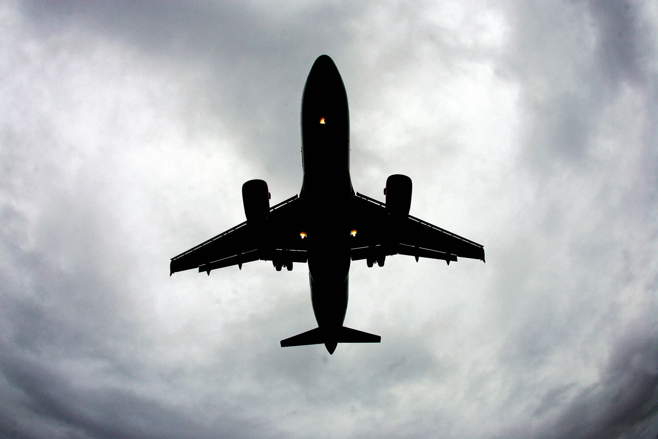 An airplane flying above Liverpool\'s Joh