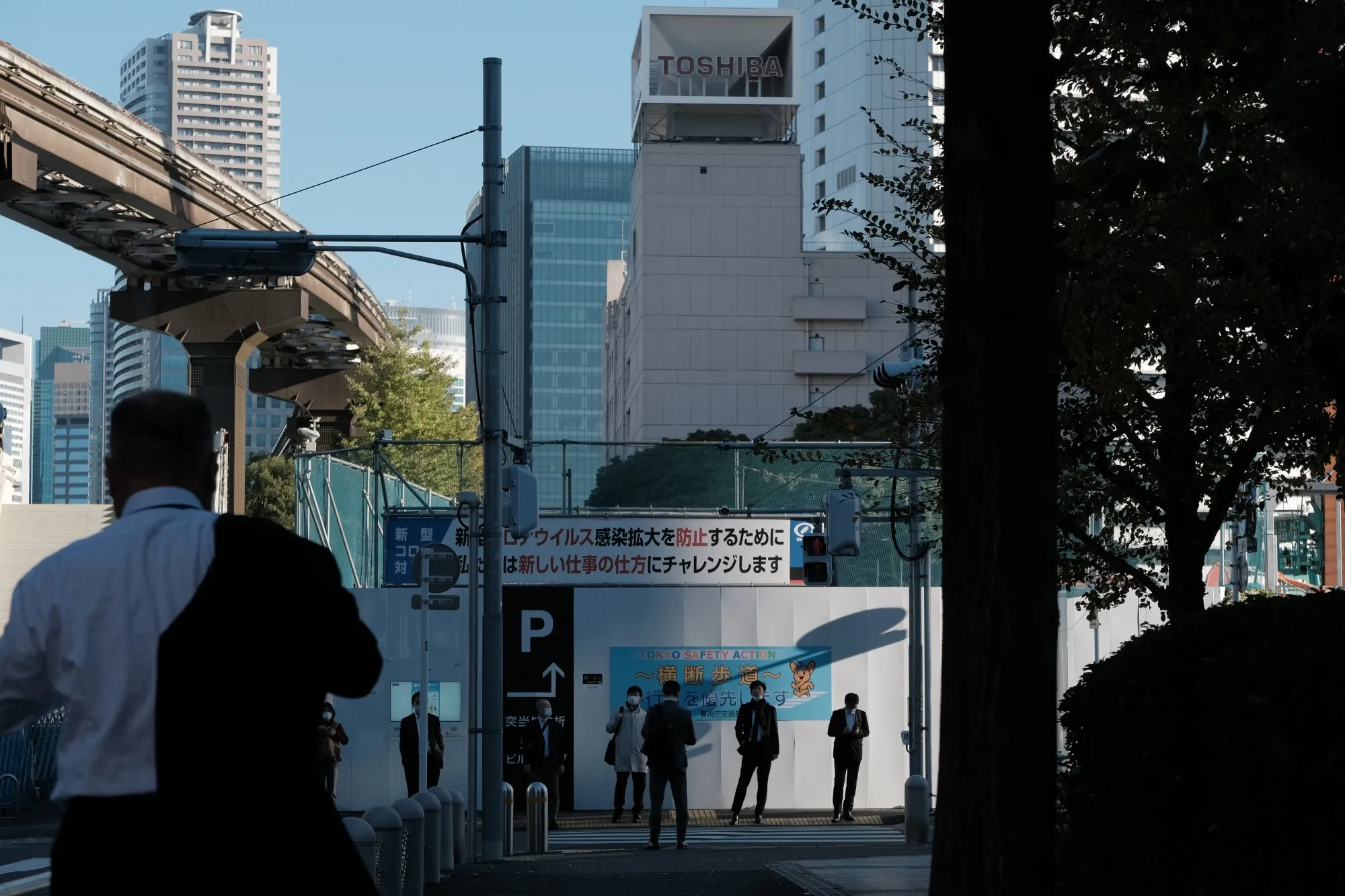 Morning commuters near the Toshiba Corp. headquarters in Tokyo.
