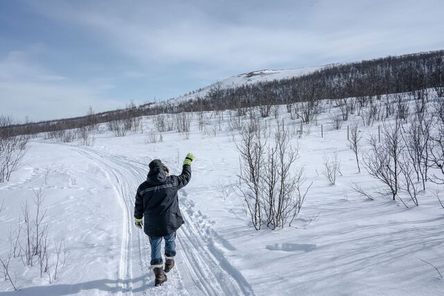 Person pointing towards a future mining site