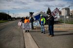 Demonstrators hold signs during a union workers strike outside the Kellogg plant in Battle Creek, Michigan, on&nbsp;Oct. 22.&nbsp;