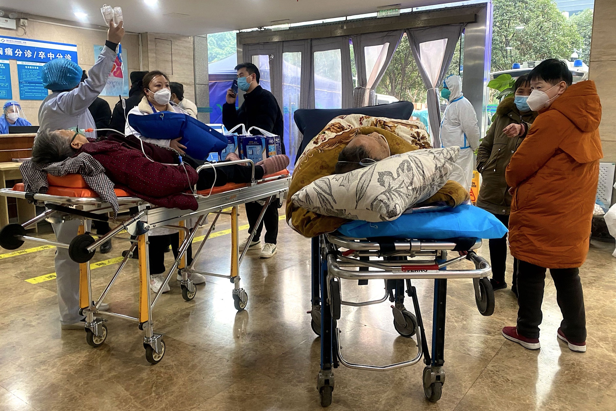 Covid-19 patients on stretchers in the emergency ward of the First Affiliated Hospital of Chongqing Medical University on Dec. 22.