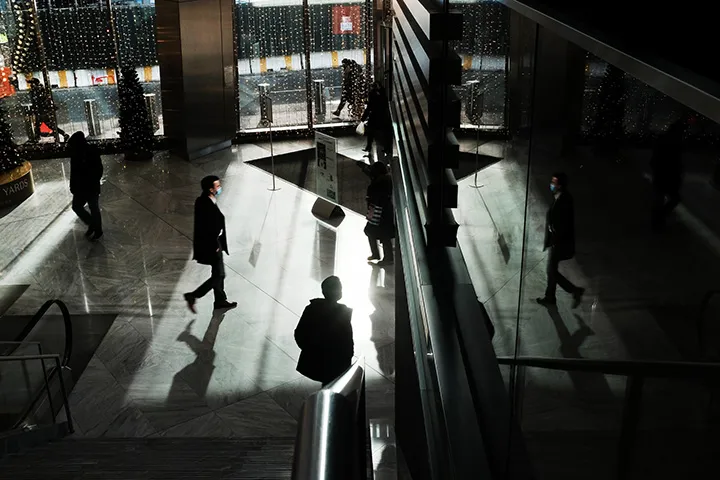 People walk through a shopping mall in New York, U.S.