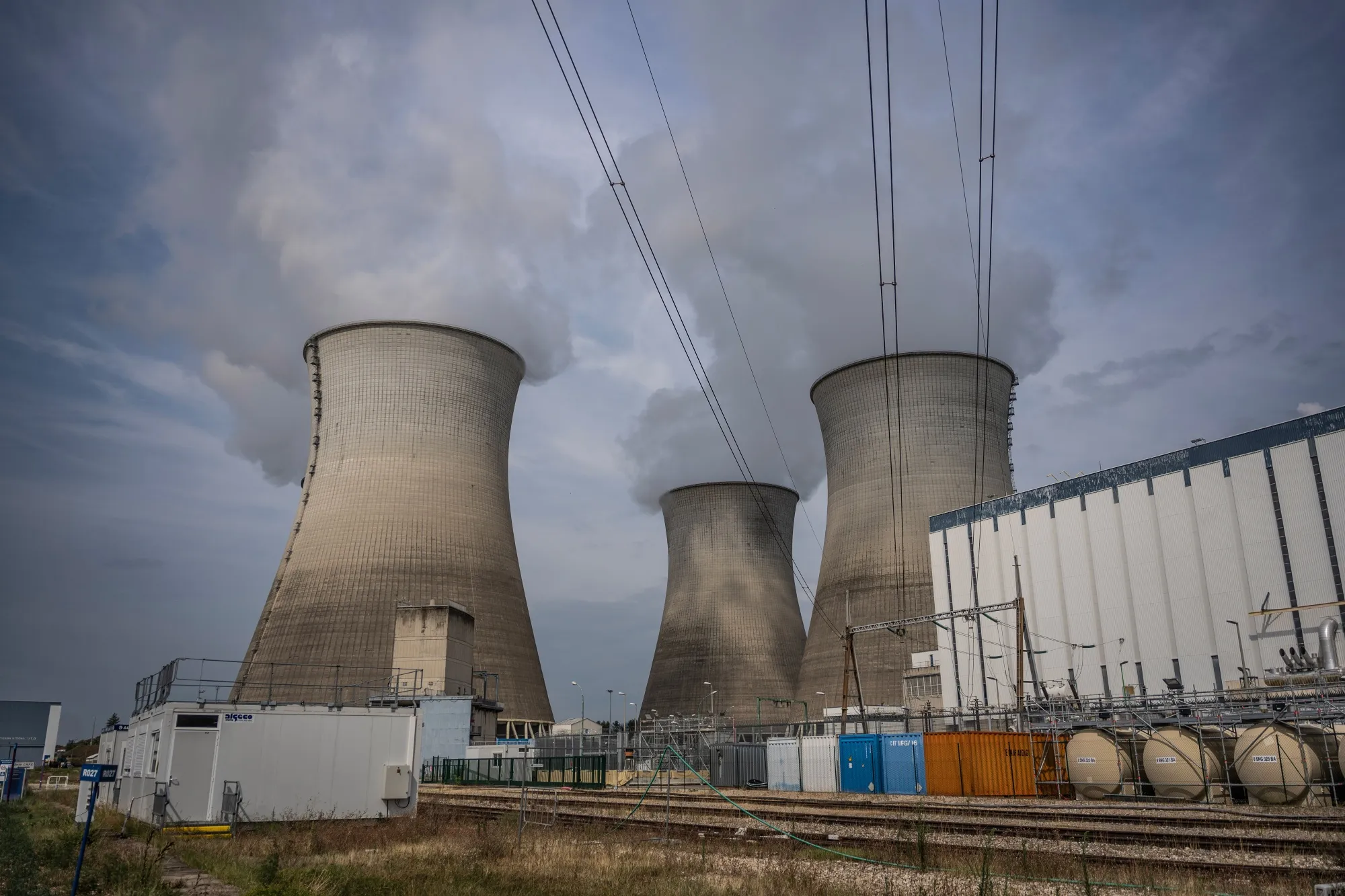 Vapor rises from cooling towers of the Bugey nuclear power station, operated by Electricitie de France SA (EDF), in Bugey, France.