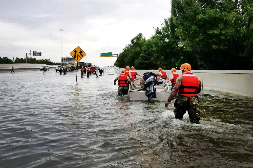 HOUSTON, TX - AUGUST 27: In this handout provided by the Army National Guard, Texas National Guardsmen rescue a resident by boat during flooding caused by Hurricane HarveyAugust 27, 2017 in Houston, Texas. Harvey, which made landfall north of Corpus Christi late Friday evening, is expected to dump upwards to 40 inches of rain in areas of Texas over the next couple of days.
