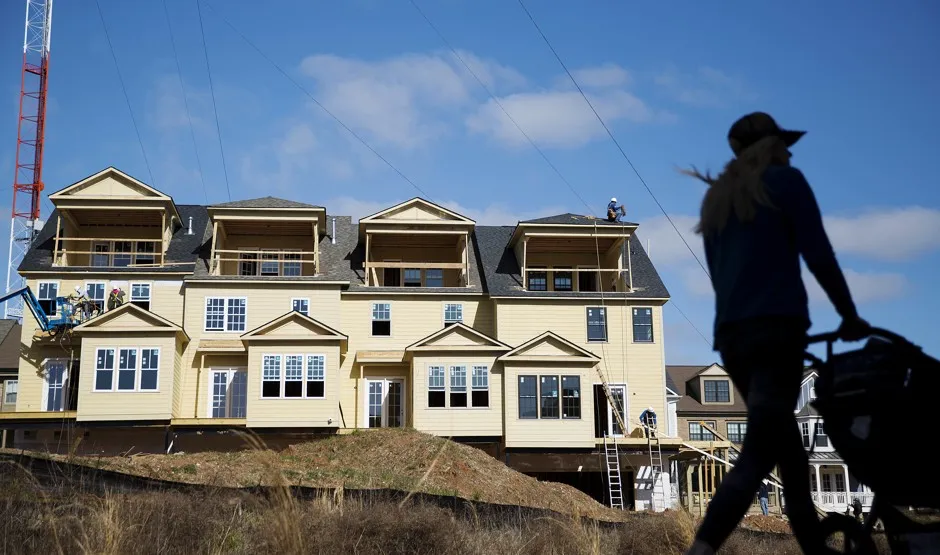 A stroller passing new townhomes under construction along Atlanta's BeltLine. 