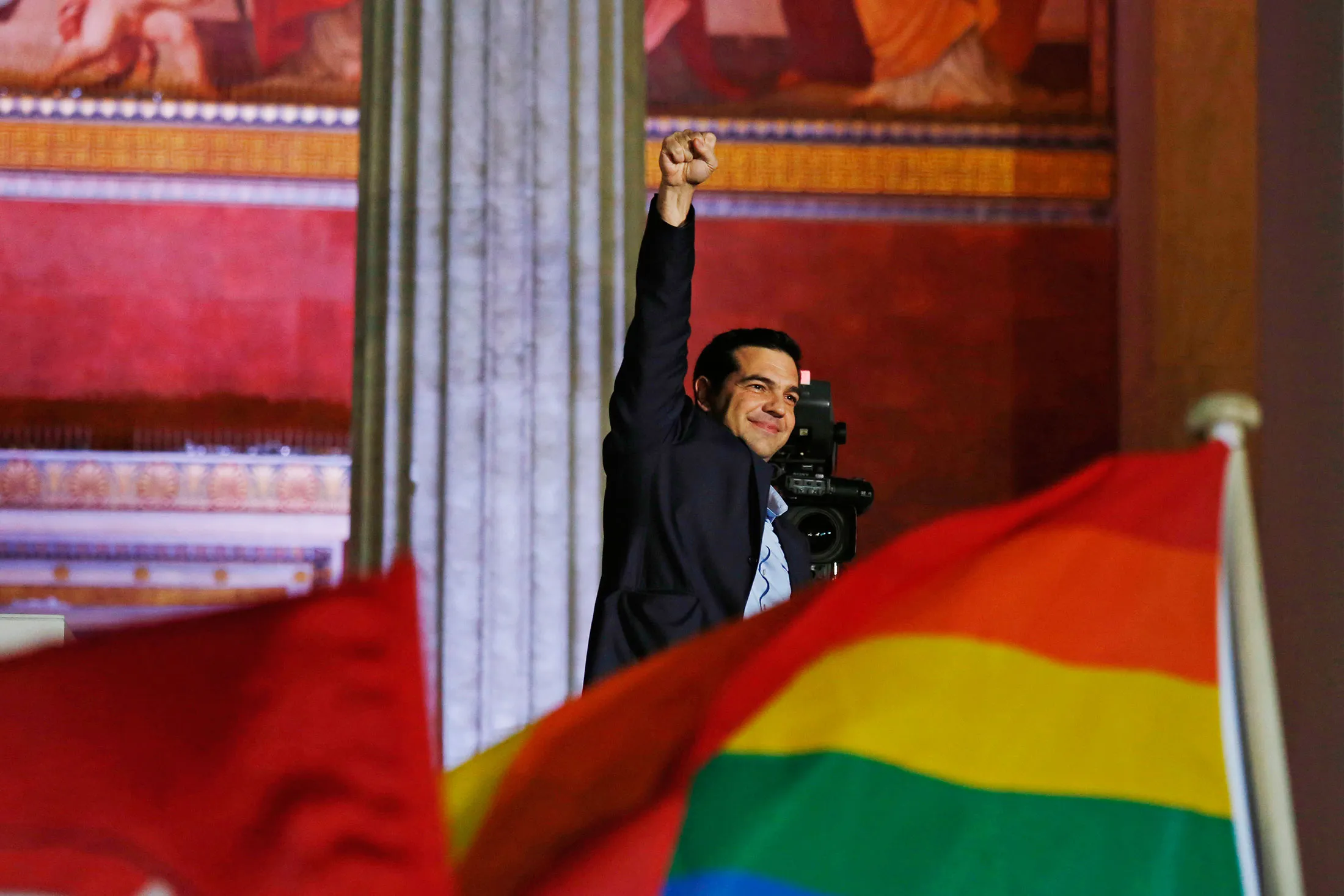 Alexis Tsipras waves to supporters at Athens University following election victory on Jan. 25, 2015.
