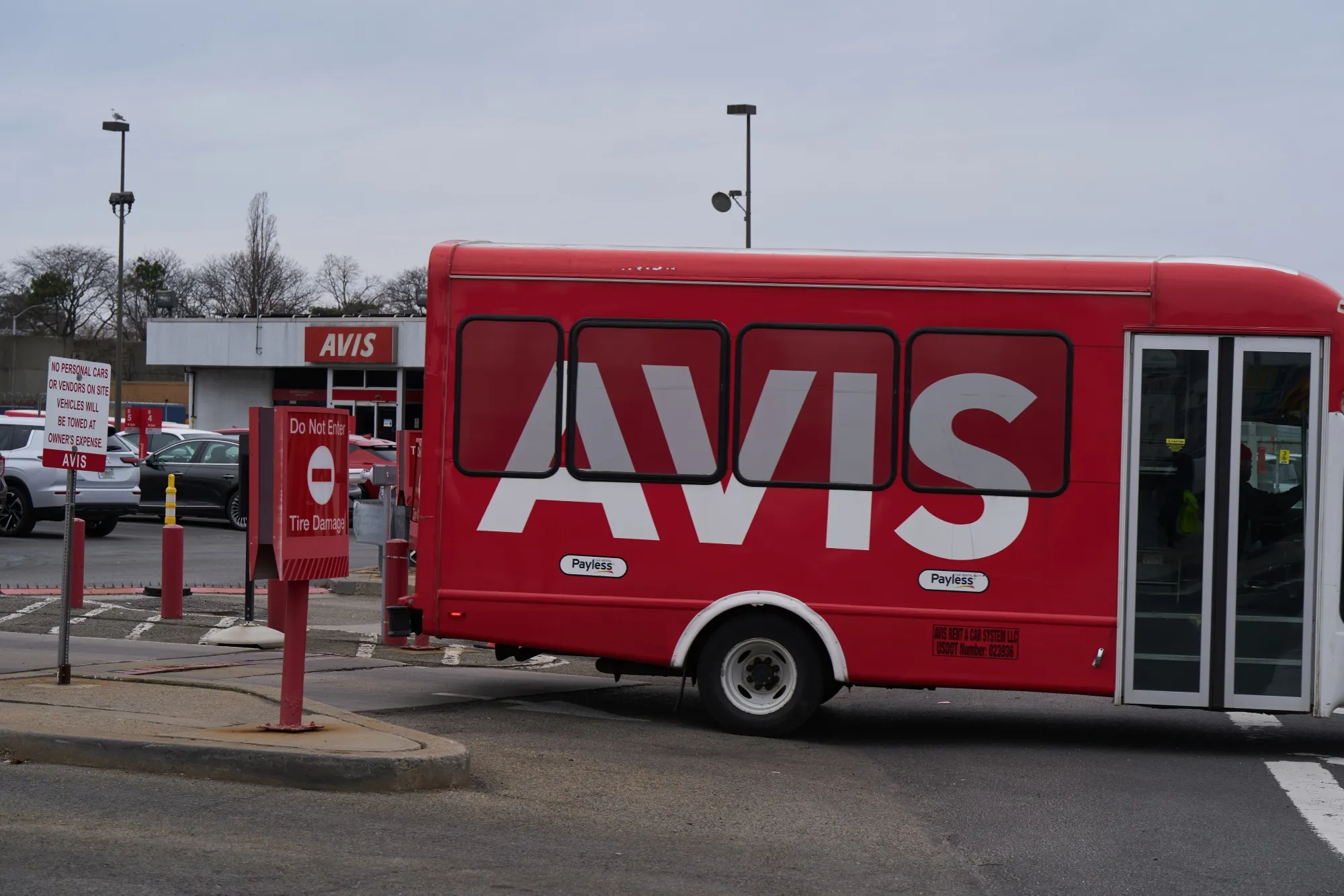 An airport shuttle departs an Avis rental location near LaGuardia Airport (LGA) in the Queens borough of New York.