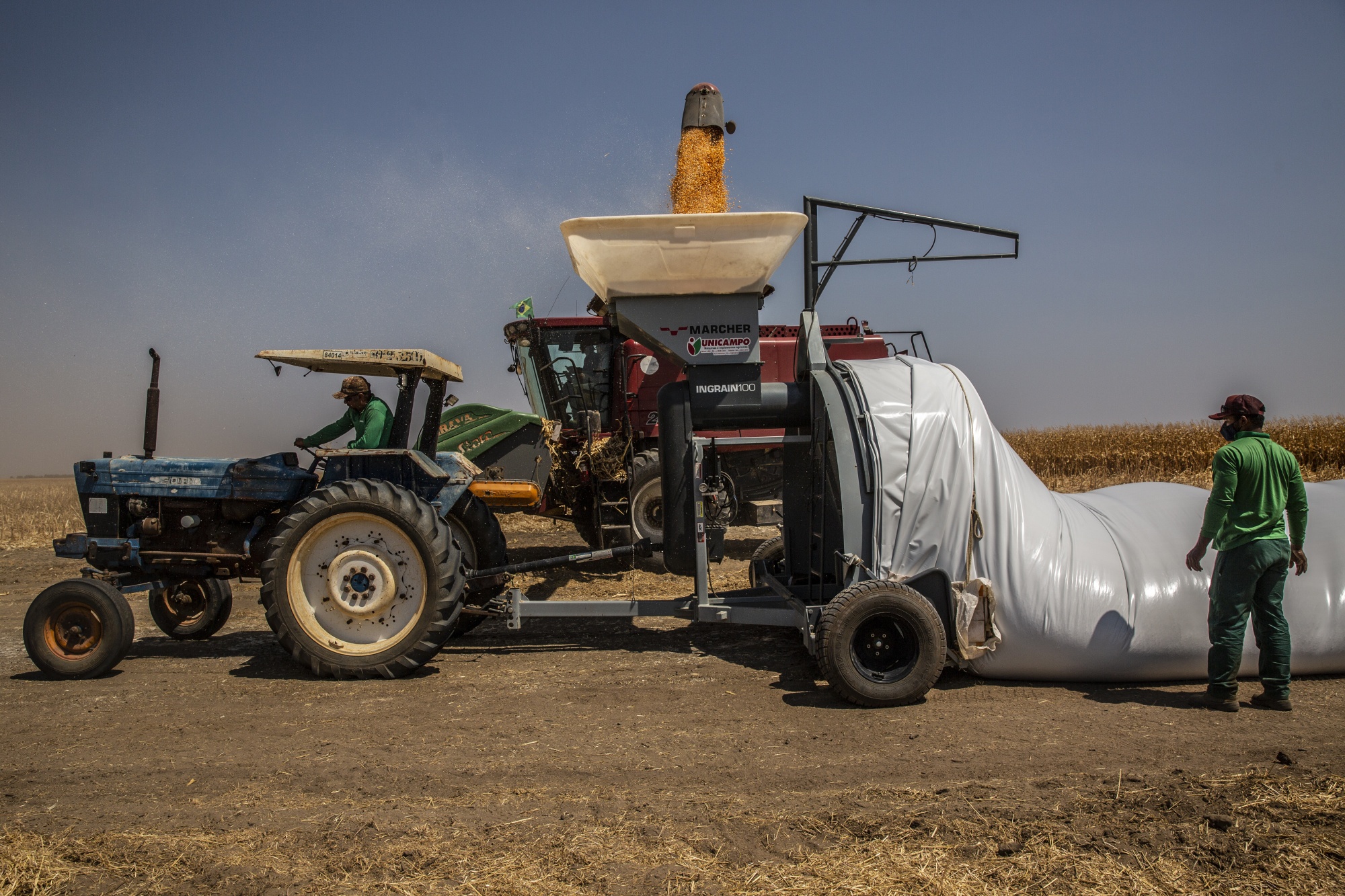 Corn is loaded into a grain storage bag during a harvest at a farm in Correntina, Bahia state, Brazil, on Sept. 20.