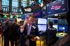 A trader works on the floor of the New York Stock Exchange (NYSE) .