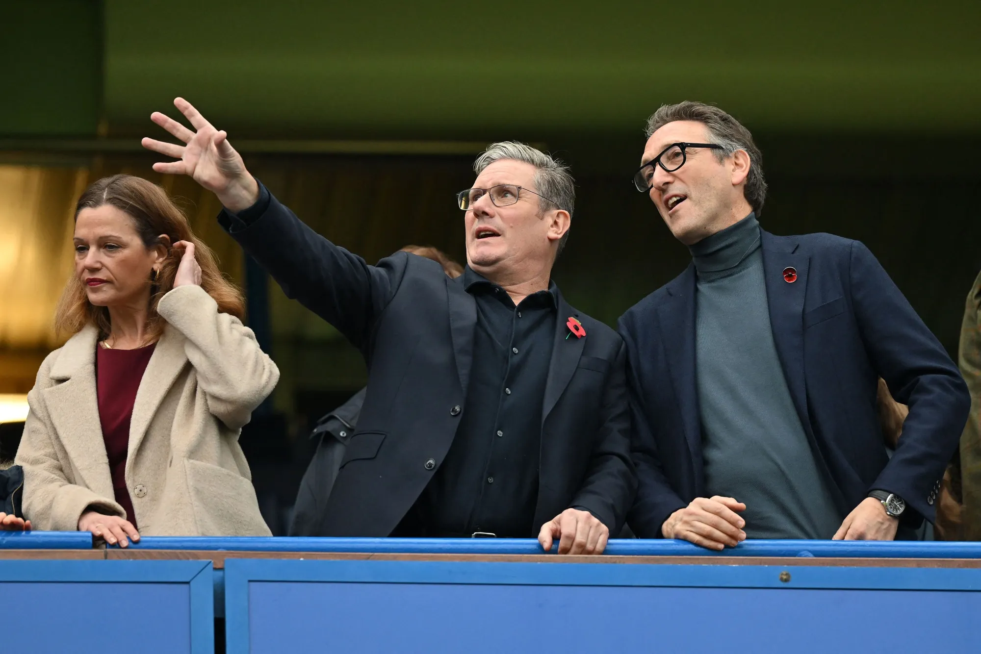 Keir Starmer, center, and Jonathan Goldstein watch Chelsea v Arsenal in London on Nov. 6.