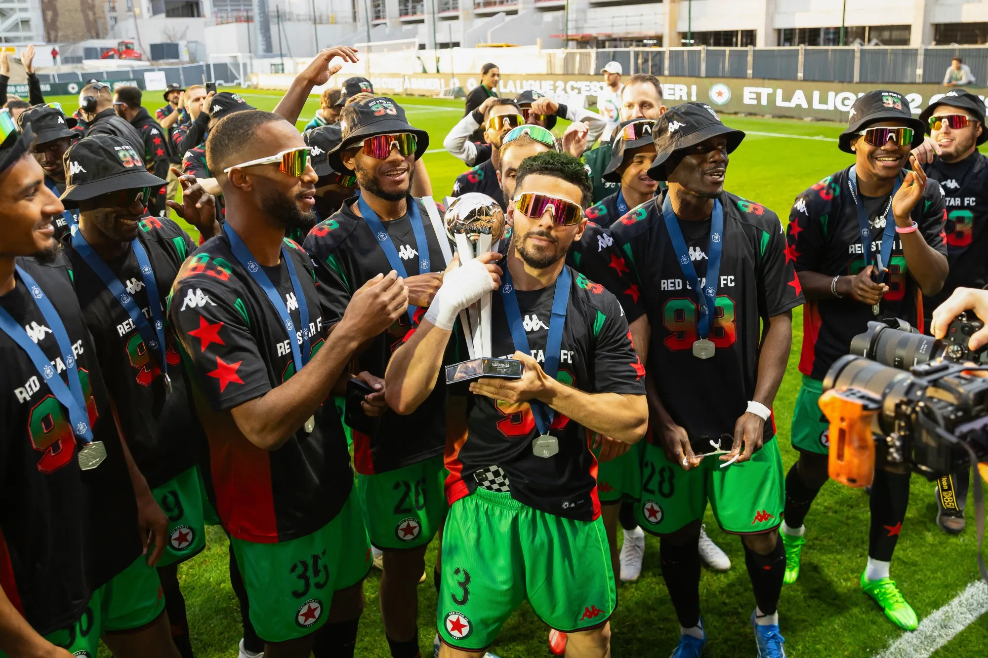 Red Star FC's players celebrate with the French National Championship trophy on May 18.