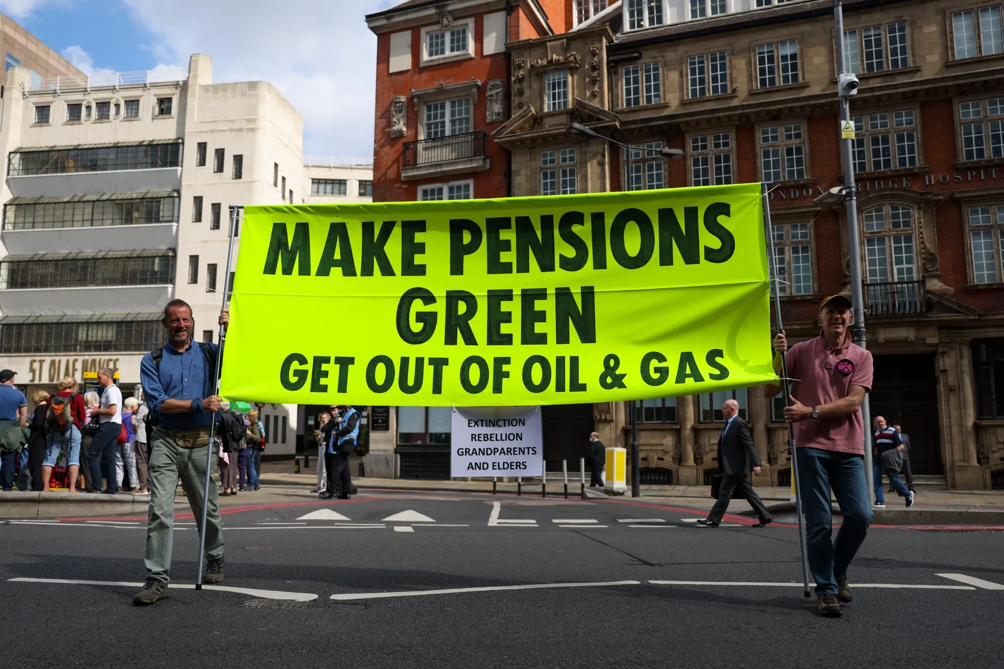 Climate activists from Extinction Rebellion hold a banner during protests in London in 2021.