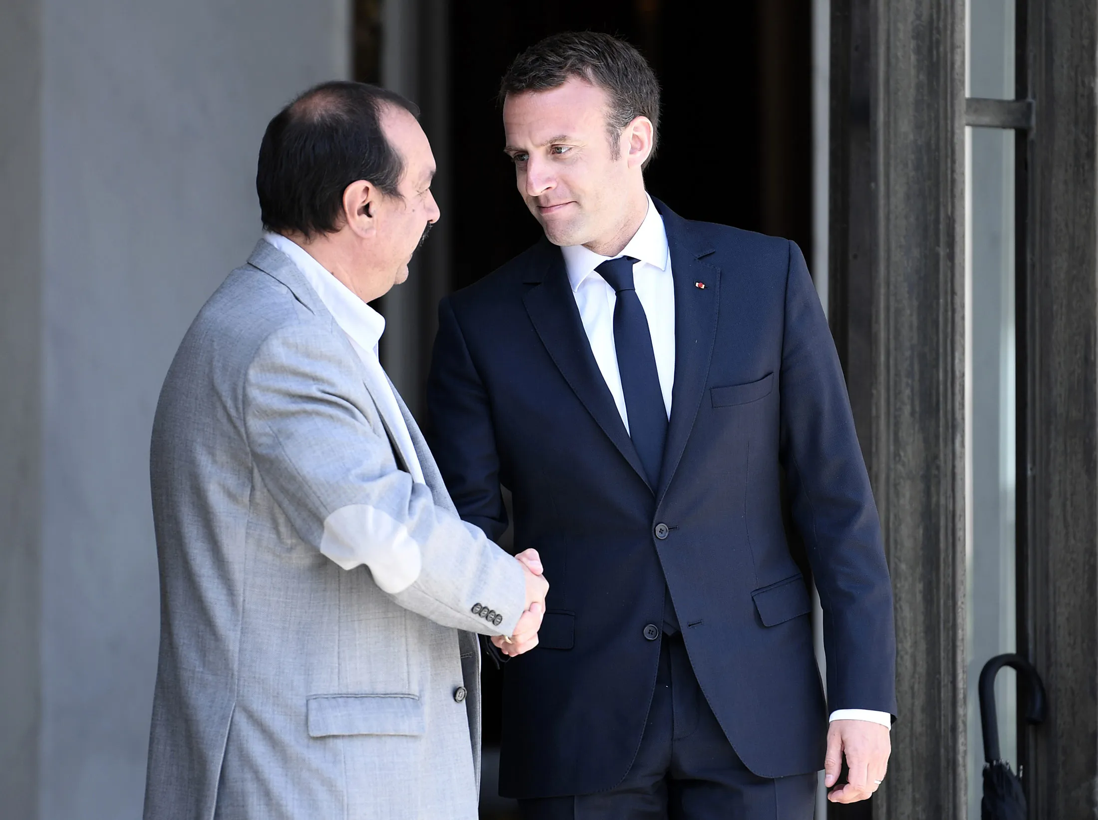 Philippe Martinez,&nbsp;general secretary of the General Confederation of Labour union,&nbsp;shakes hands with&nbsp;Emmanuel Macron&nbsp;at the Elysee palace in Paris.
