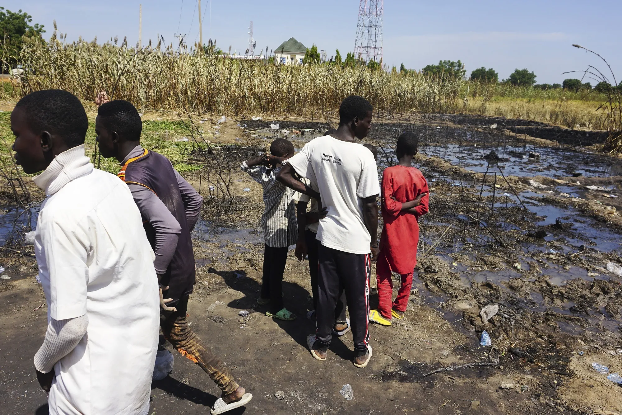 Residents look at the site of an explosion of a fuel tanker&nbsp;in Majiya, Nigeria on Oct. 16.