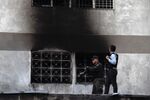 
Security forces check a building after an explosion was heard during a ceremony attended by Venezuelan President Nicolas Maduro in support of the National Guard in Caracas on August 4, 2018.
