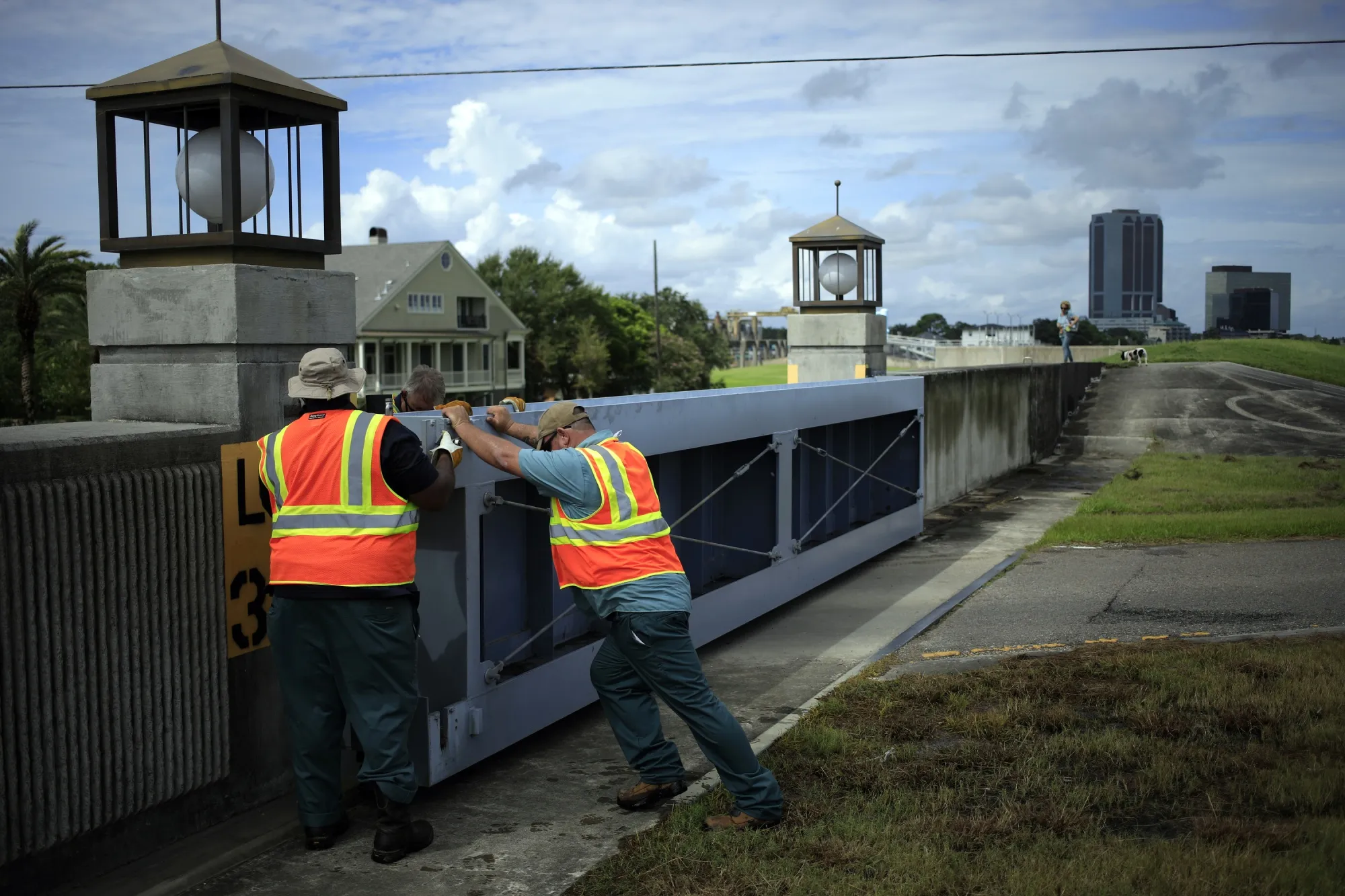 Workers close the floodgate at Bonnabel Boat Launch on Lake Pontchartrain ahead of Hurricane Ida in Metairie, Louisiana, on Aug. 28.