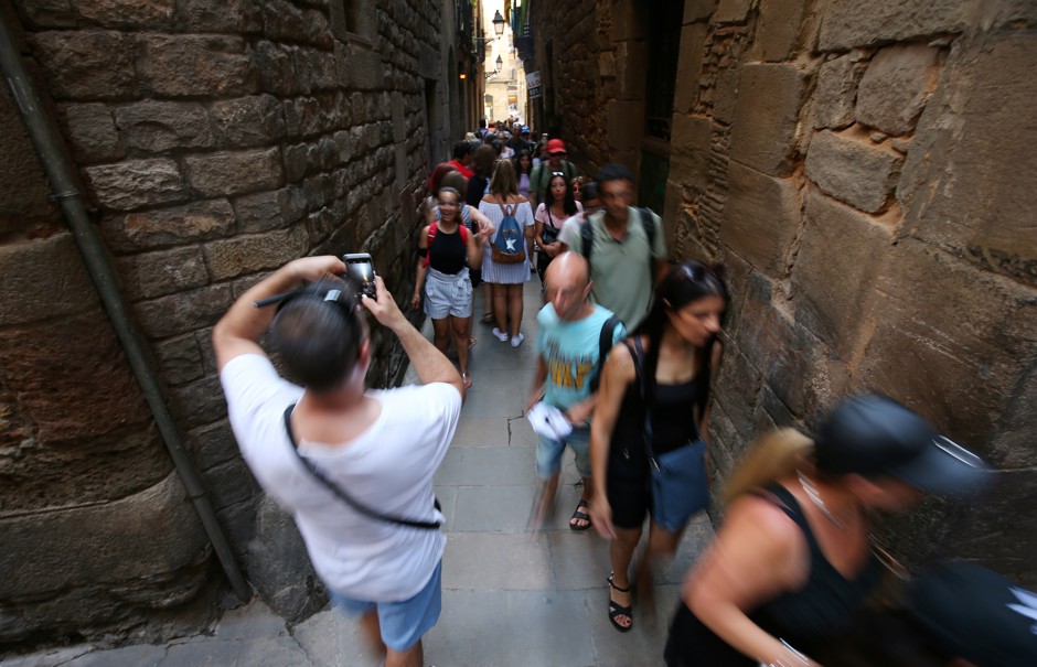 Pretty but packed. Barcelona's Airbnb rules are trying to help stop tourism overwhelming its old city.