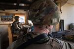 U.S. Army soldiers look onto Baghdad from a guardhouse on the perimeter of the International Zone on May 30.