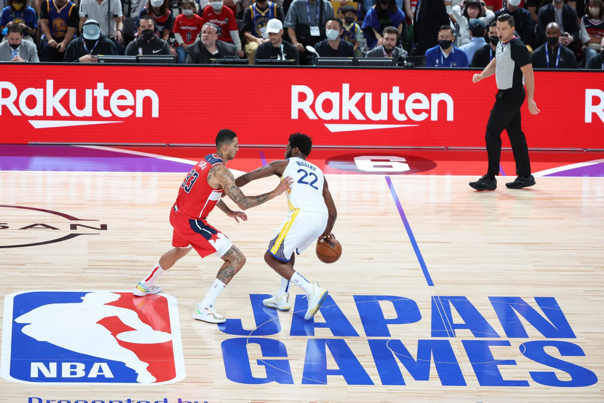 Andrew Wiggins&nbsp;of the Golden State Warriors dribbles&nbsp;against Kyle Kuzma of the Washington Wizards in Saitama, Japan.