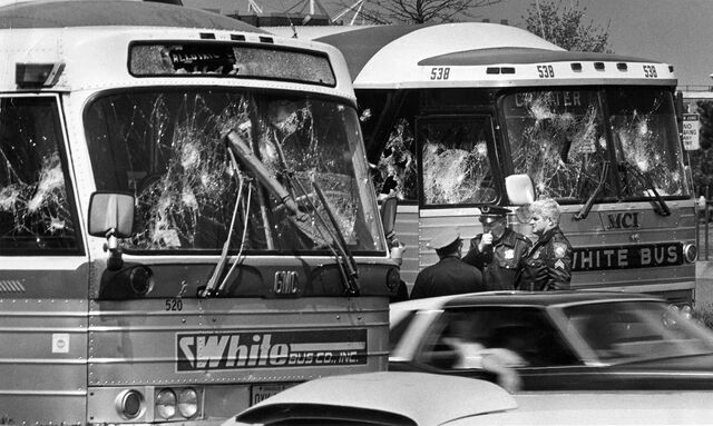 Buses chartered by participants in a Boston march against racism, after they were damaged by protesters throwing rocks and bottles, May 3, 1975.