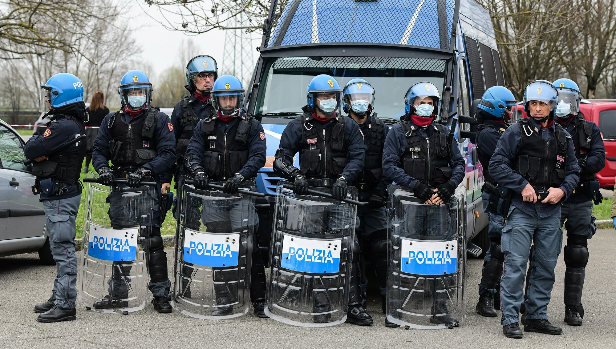 Anti-riot police officers stand guard outside the Sant’Anna prison in Modena, Italy on March 9.
