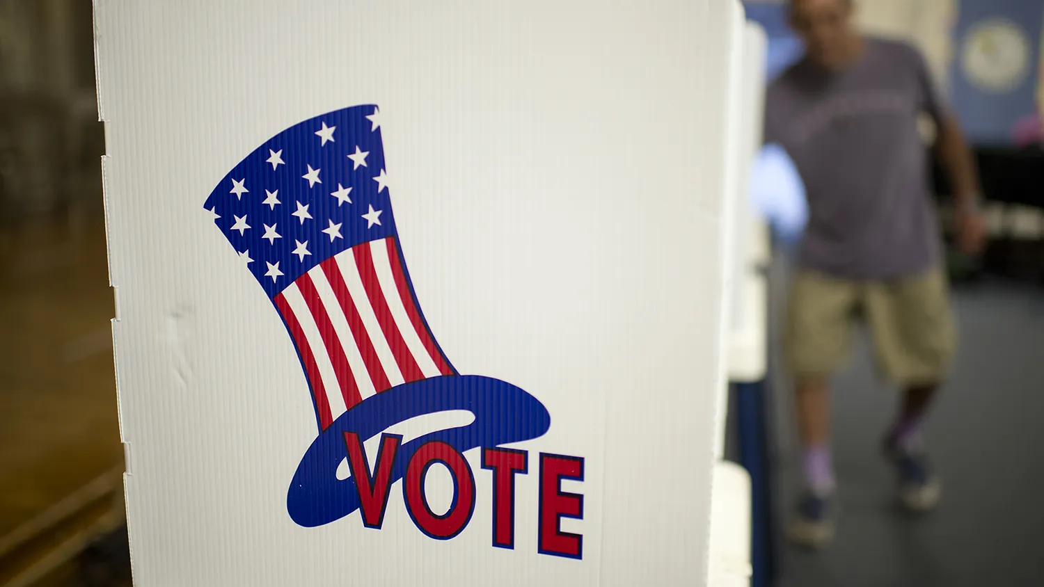 A poll worker prepares voting booths at a polling station in Los Angeles on May 21, 2013.
