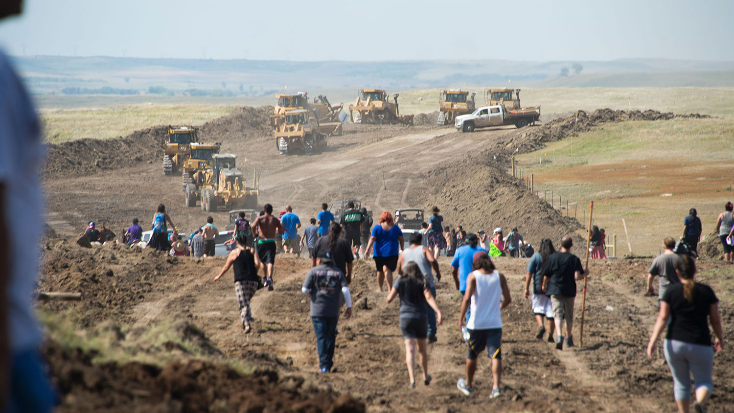 Native American protestors and their supporters are confronted by security during a demonstration against work being done for the Dakota Access Pipeline near Cannon Ball, North Dakota, on Sept. 3, 2016.

