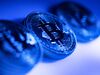 A collection of bitcoin tokens sit in this arranged photograph in London, U.K., on Tuesday, Jan. 9, 2018. On Wednesday, billionaire Warren Buffett said on CNBC that most digital coins won't hold their value.