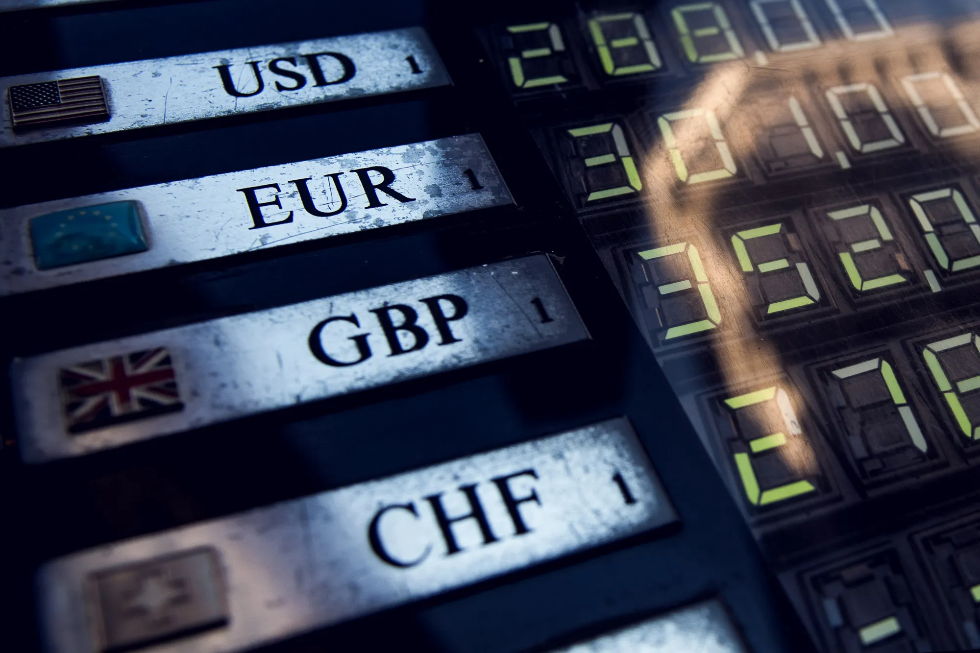 A sign advertising U.S. dollar, euro, pound sterling and swiss franc exchange rates stands outside a foreign currency exchange bureau in Budapest, Hungary, on Tuesday, Dec. 27, 2016. Hungarian retail sales rose at the slowest pace since the start of the year in October, casting doubt on cabinet projections that a fourth-quarter upswing will lift economic growth to the government's target.