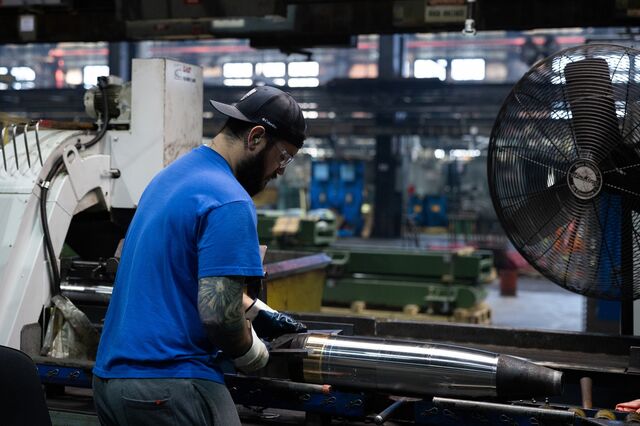 An employee performs a series of inspections on a projectile at the Scranton Army Ammunition Plant.