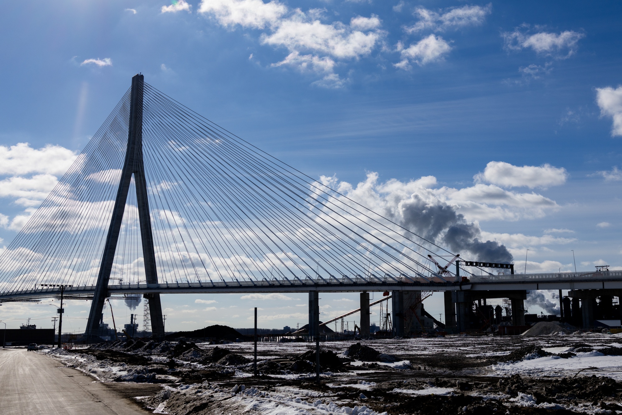The Gordie Howe International Bridge under construction in Detroit, Michigan, US, on Thursday, Feb. 12, 2026. President Donald Trump threatened to block the opening of a new bridge that connects Michigan and Ontario until the US was given compensation and ownership of half of it, saying he'd start negotiations immediately. Photographer: Emily Elconin/Bloomberg